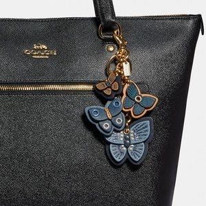 BACK IN STOCK AUTHENTIC COACH CUSTARD BUTTERFLY 🦋 LEATHER RING CLIP IN PACKAGE